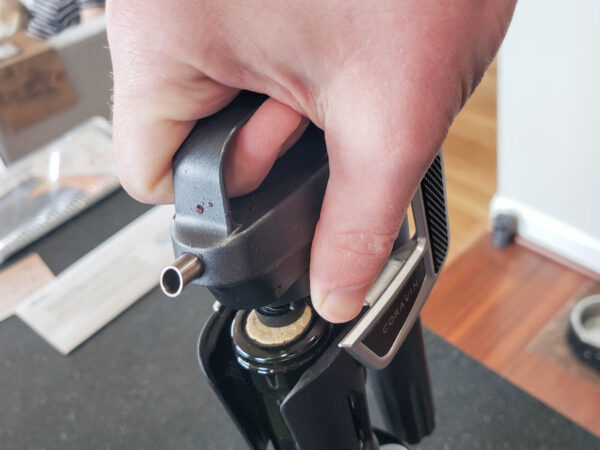 Pull the Coravin needle out of the bottle